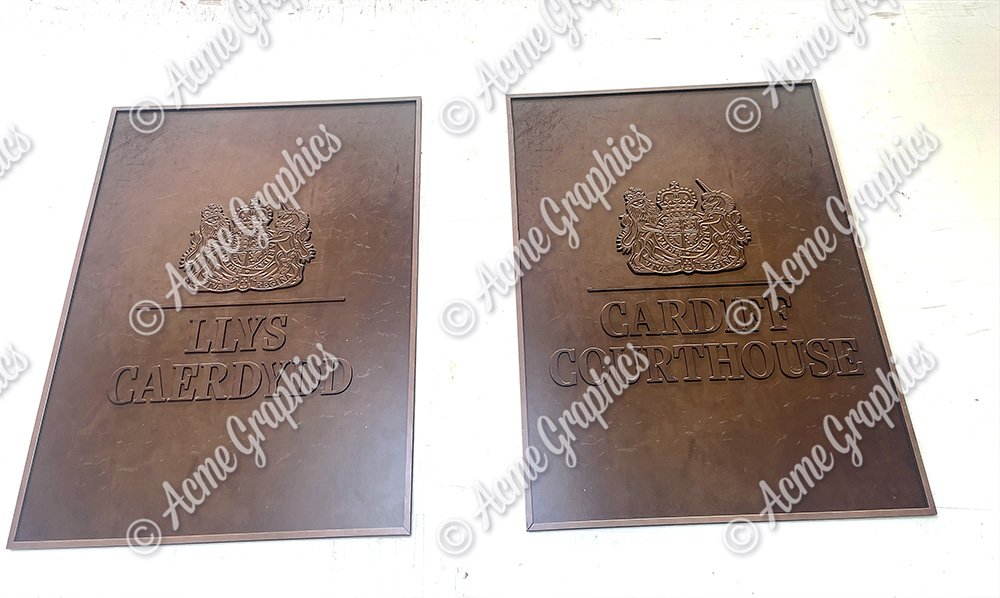 two metallic effect prop court signs for location dressing